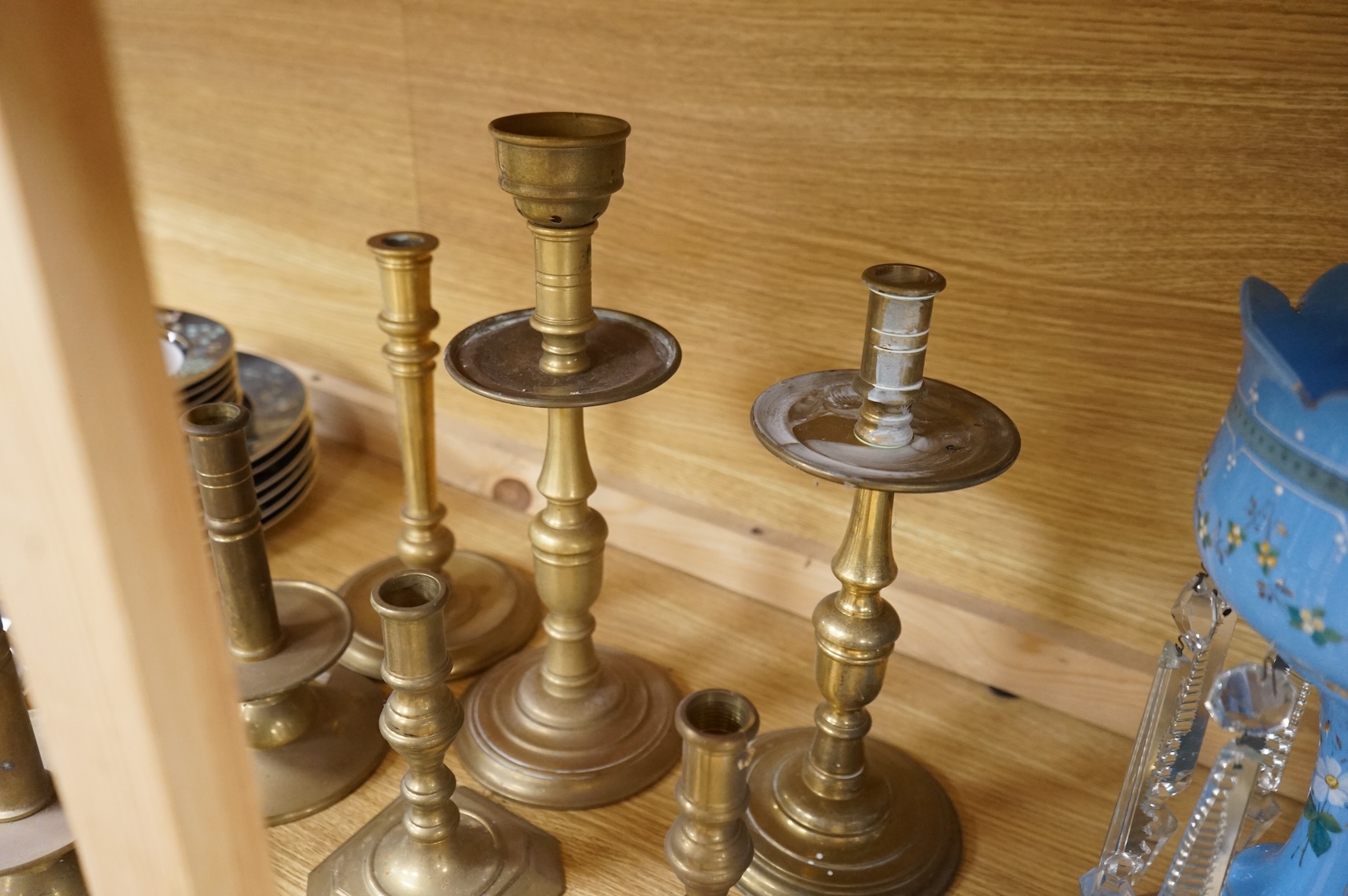 A collection of 19th century and later brass candlesticks, largest 33cm high
